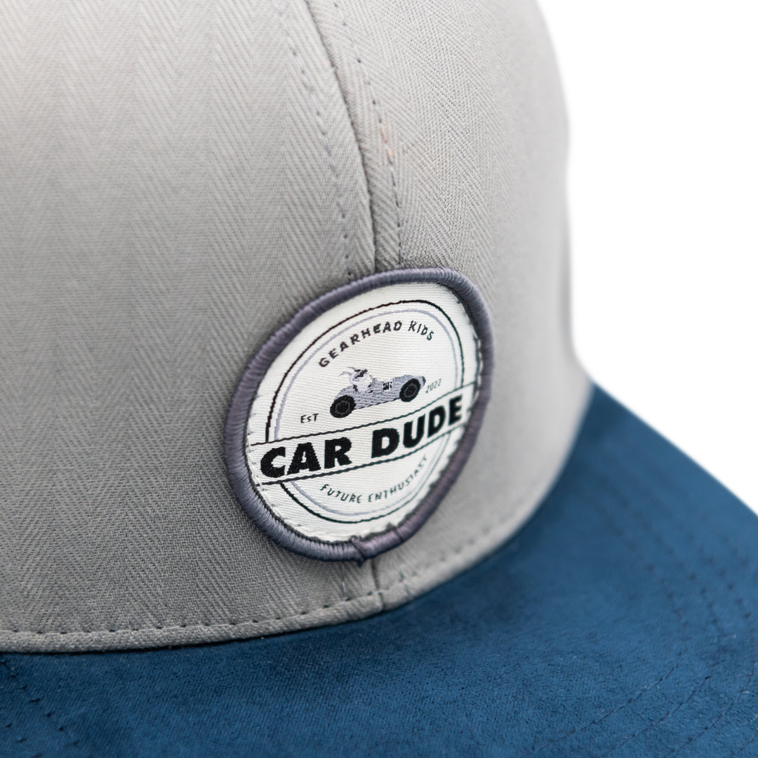 Close-up of the Gearhead Kids Bunny Driver logo patch on a gray snapback - Gearhead Kids
