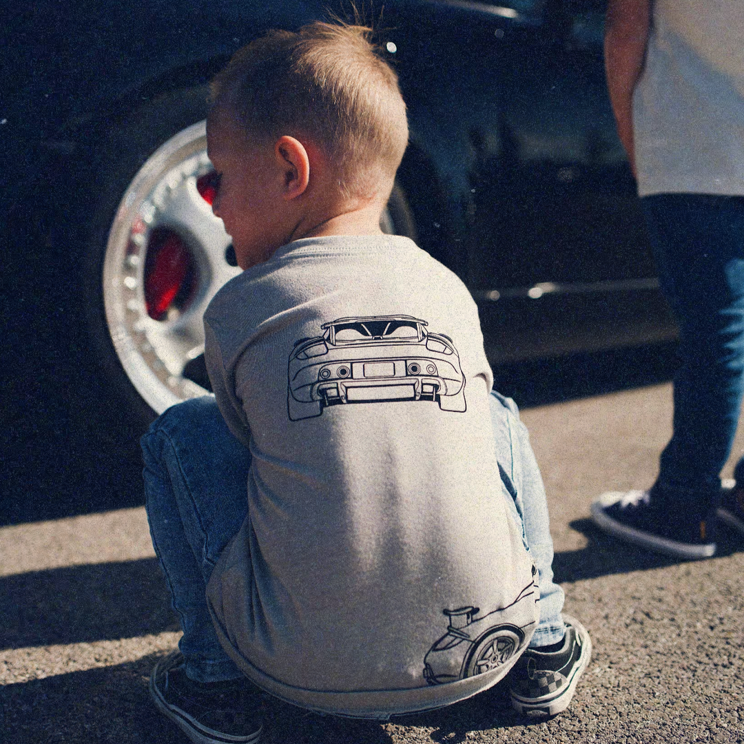 Young car enthusiast wearing a Carrera GT triple-profile graphic tee - Gearhead Kids