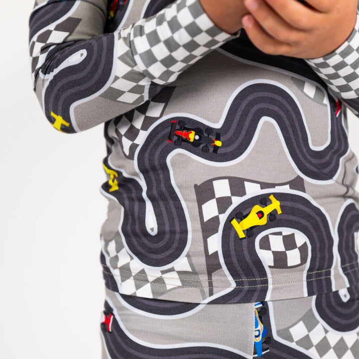 Close-up of open-wheel racing car print on soft bamboo pajama fabric - Gearhead Kids