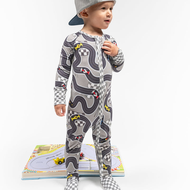 Circuit Dreamer baby pajamas with open-wheel F1 and Indy style race cars on a track - Gearhead Kids