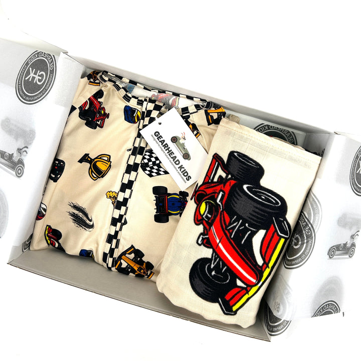 GIft set for baby featuring Formula 1 themed bamboo pajamas and blanket with race cars | Gearhead Kids