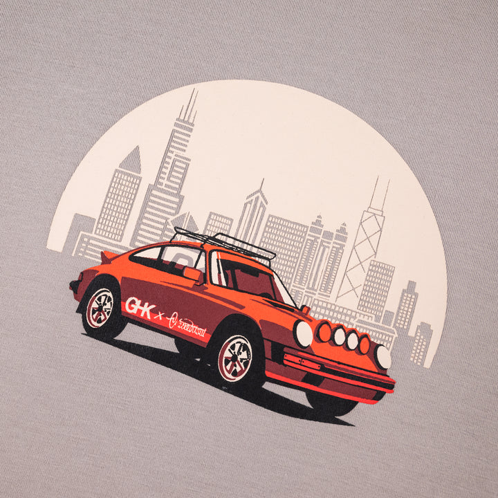 closeup of the Safari Rally Car graphic t-shirt in mocha color - red rally car and Chicago skyline graphic created for Checked It Out show in Chicago | Gearhead Kids