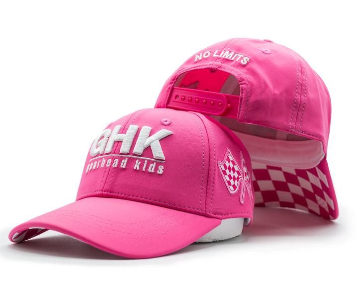 A bright pink snapback hat shown from the front and back. The front features white embroidered text reading 'GHK' and 'gearhead kids', while the back displays 'NO LIMITS' in white. 