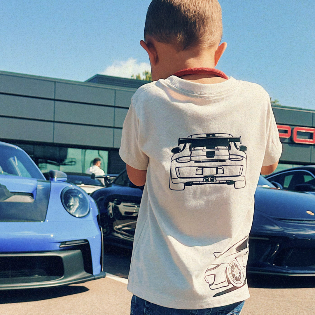 Young car fan wearing the GT3RS Outline t-shirt at an automotive event - Gearhead Kids